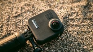 GoPro MAX 360° camera capturing panoramic views from atop a rugged rock, best camcorder, GoPro MAX
