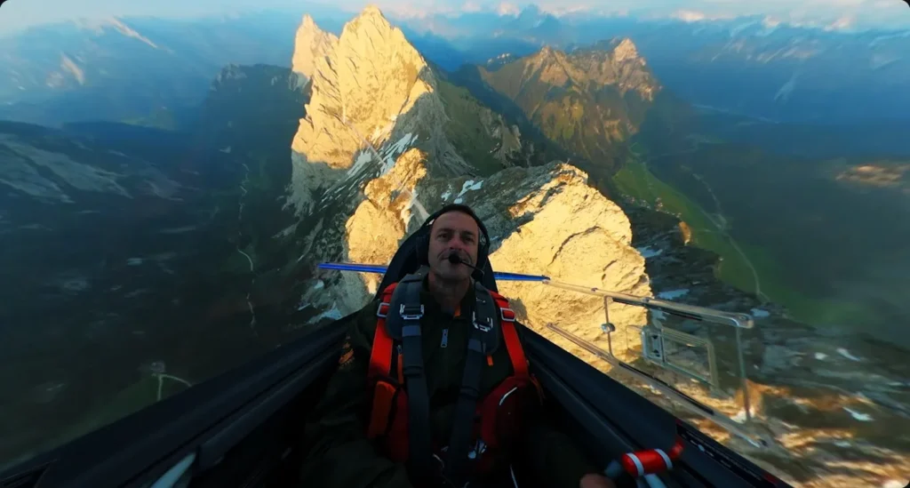 Man flying a glider over mountain, GoPro MAX