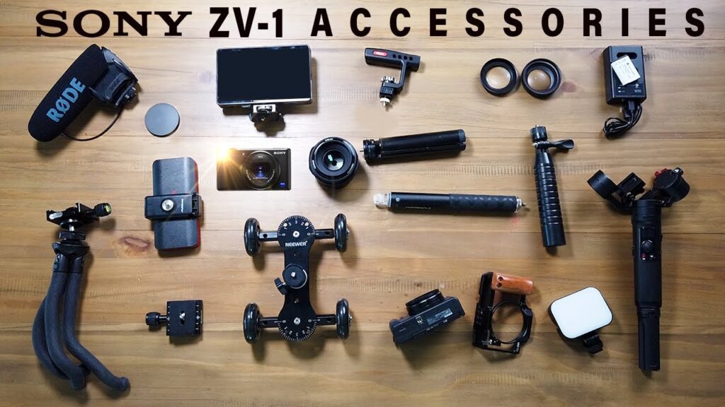 A table topped with a variety of camera accessories, including a microphone, a tripod, a phone holder, a tripod, a phone holder, and a Sony ZV-1 camera, Sony ZV-1