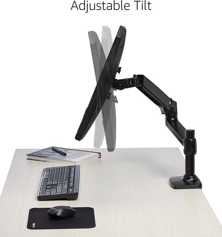A black monitor sitting on a white Ergotron LX Desk Monitor Arm 45-241-224. The monitor is labeled with the text "Adjustable Tilt".