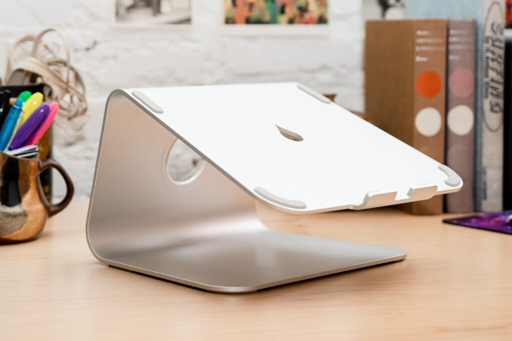 Laptop stand on a wooden desk, Rain Design mStand