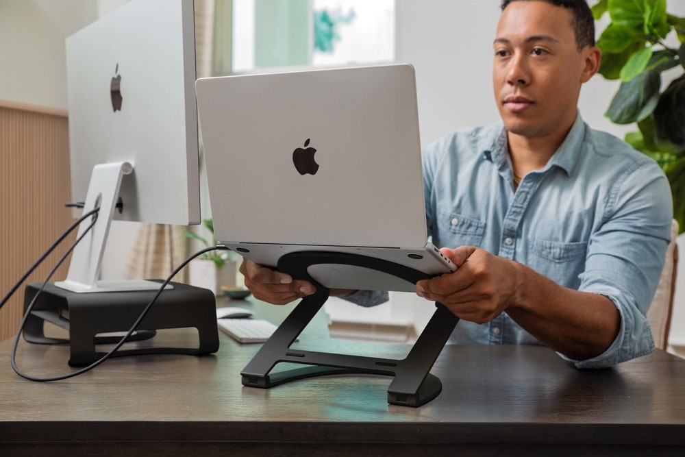 A MacBook mounted on a stand with a curved design, best laptop stand, Twelve South Curve Flex